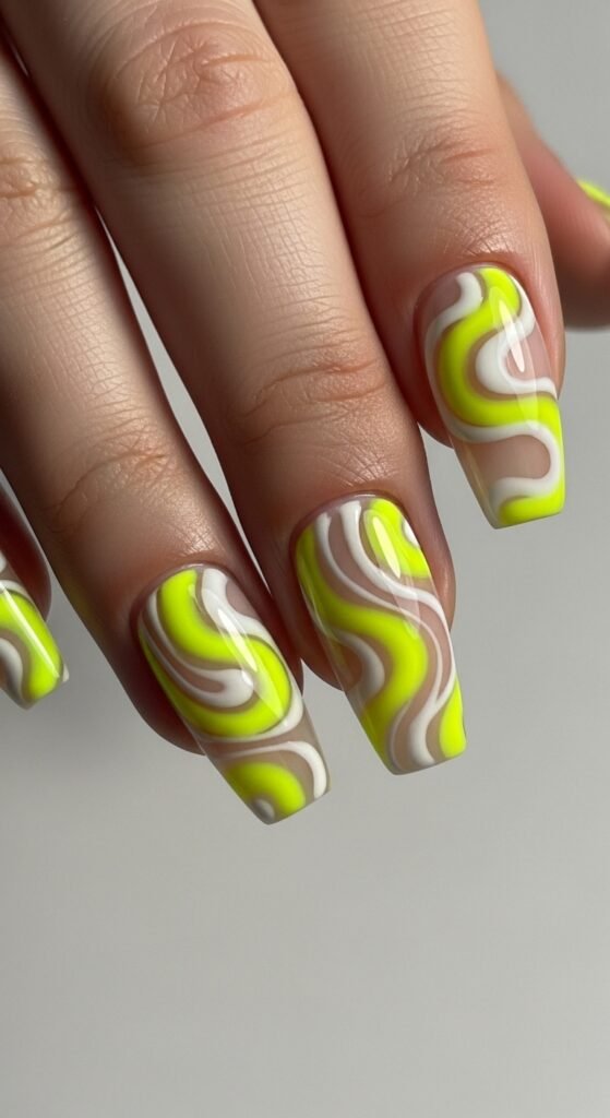 9. Neon Yellow Swirl Nails