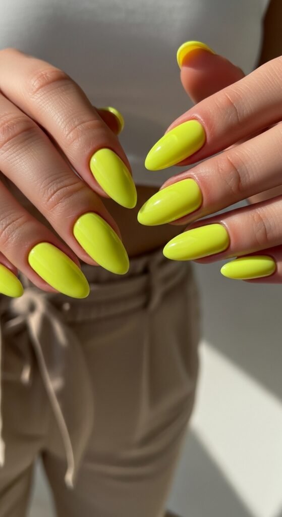 8. Neon Yellow Almond Nails