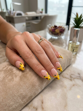 3. Sunflower French Tip Nails